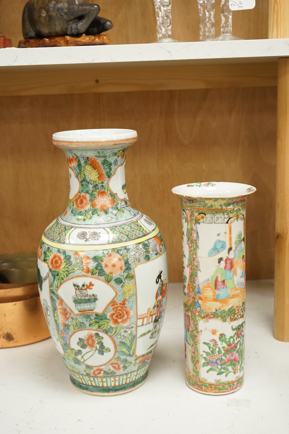 Two Chinese porcelain vases to include a famille rose sleeve vase and a larger famille verte vase, 36cm high